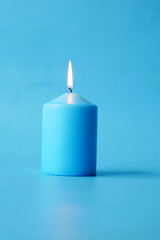 Obraz na płótnie Canvas blue color candles slowly burning down.