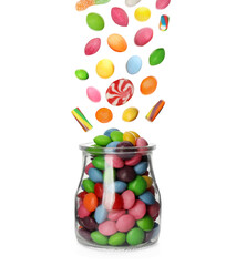 Different delicious candies falling into glass jar on white background