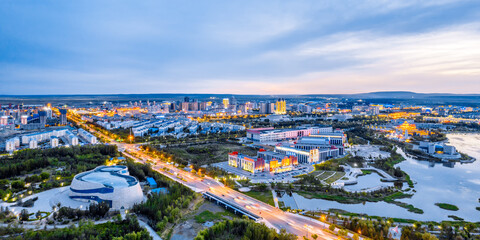 Aerial photography of night view of Xilin River and city skyline in Xilinhot City, Xilin Gol League, Inner Mongolia © Govan