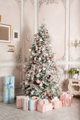 Fototapeta na wymiar Christmas tree with big presents light vertical