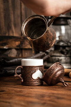 Turkish Coffee is pouring in coffee cup