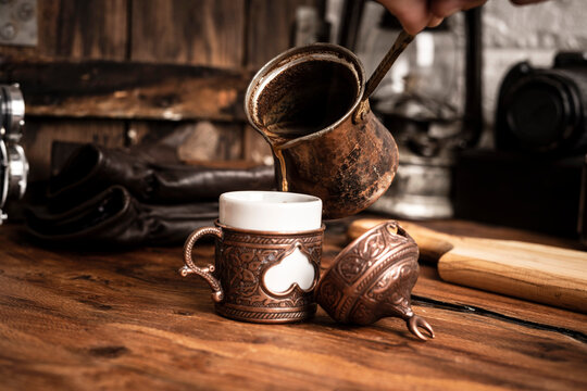 Turkish Coffee is pouring in coffee cup