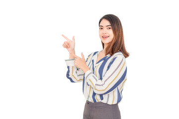 Thai long haired Asian woman wearing long sleeves, she is looking at the camera smiling and pointing to the left against a white background.