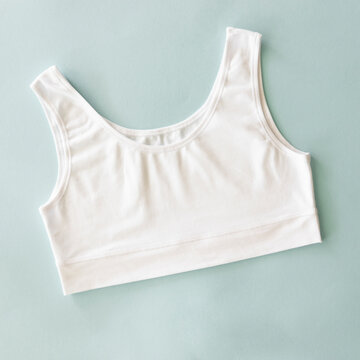 Cotton underwear top for woman, white sport bra. Top view flat lay with space for mockup imprint