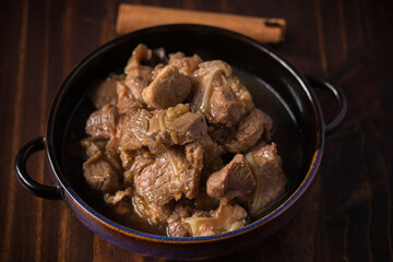 braised pork cartilage soup on wooden background