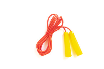 Red skipping rope with yellow handles on white background