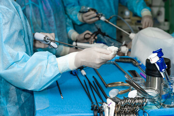 Surgical laparoscopic manipulator in the hands of a surgeon. Selective focus. Minimally invasive...