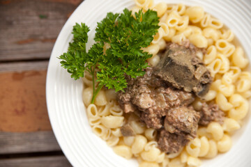 Delicious pasta with stewed chicken liver and parsley