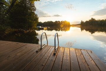 First light at a lake cottage dock