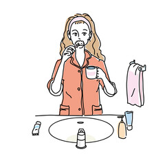 パジャマで歯磨きをする女性