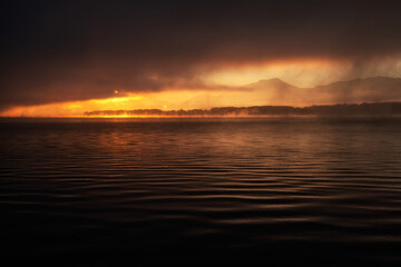 Fototapeta premium Sunrise and dark misty weather over the lake Liptovska Mara at Slovakia