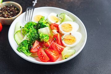 salad buddha bowl boiled egg, broccoli, tomato, cucumber, vegetables meal snack on the table copy space food background veggie vegan or vegetarian 