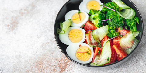 salad buddha bowl boiled egg, broccoli, tomato, cucumber, vegetables meal snack on the table copy space food background veggie vegan or vegetarian 