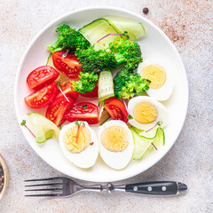 salad buddha bowl boiled egg, broccoli, tomato, cucumber, vegetables meal snack on the table copy space food background veggie vegan or vegetarian 