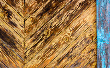 Obraz premium Old grey and brown wooden background with cracks and scratches in vintage style
