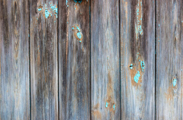 Old grey and blue wooden background with cracks and scratches in vintage style