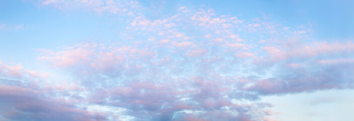 pink clouds on a blue sky background
