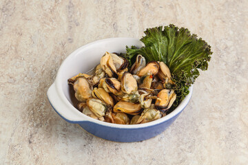 Tasty marinated mussels in the bowl