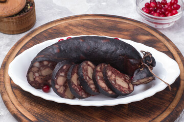 Traditional blood sausage on a white dish