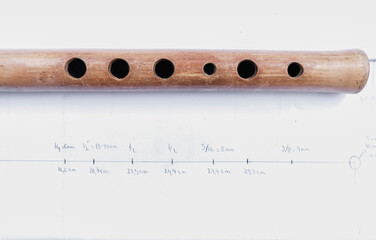 wooden flute quena holes on paper