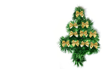 Green Christmas tree with bows made of garlands on a white background. Holiday concept. Place for text