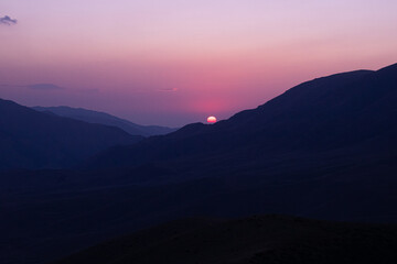 Beautiful sunset on the background of mountains