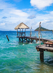 Wooden beach bar in sea and hut on pier in koh Mak island, Trat, Thailand
