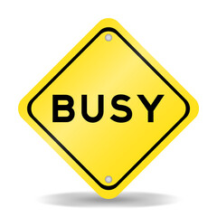 Yellow color transportation sign with word busy on white background