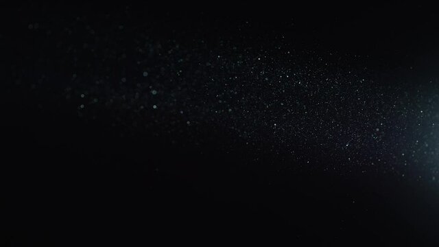 Natural Dust Organic Floating particles in stage light ray (spot) on black background. Dust in air atmosphere for your projects! Just drop it over your footage and use blending (screen) mode.