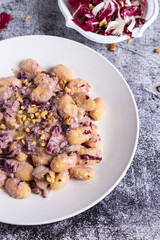 Vegan potato gnocchi with walnut and radicchio sauce