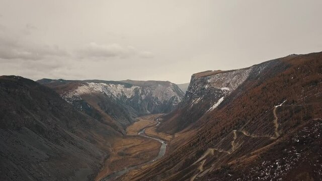 Katu Yaryk mountain pass in the valley of the Chulyshman River, Altai, Siberia, Russia. A huge stone gorge, a canyon, a mountain winding river, a dangerous serpentine highway. Freedom, loneliness