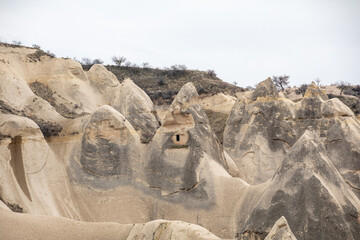 Cappadocia Turkey. Houses of local residents, dug in the sandy rocks. Dwelling of ancient people. UNESCO Monument