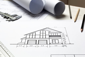 Architect's workplace. Blueprints. Designer desktop. House construction drawings.