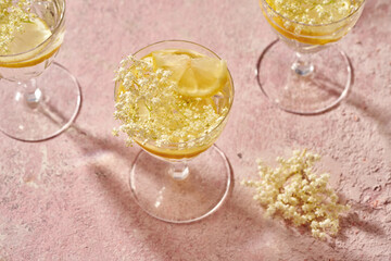 Lemonade with elder flower syrup, decorated with fresh elder flowers