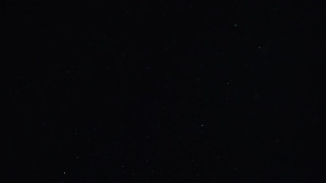 Natural Dust Organic Floating particles in stage light ray (spot) on black background. Dust in air atmosphere for your projects! Just drop it over your footage and use blending (screen) mode.