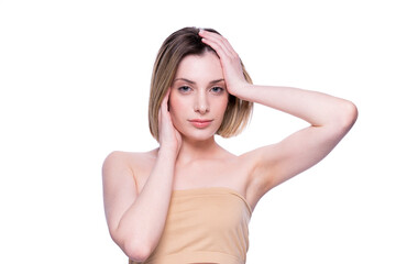 Fototapeta premium Beautiful woman with clean fresh skin touching her face. Face care treatment. Natural healthy cosmetic beautiful serious female portrait manicure hand. Cosmetology, beauty and spa