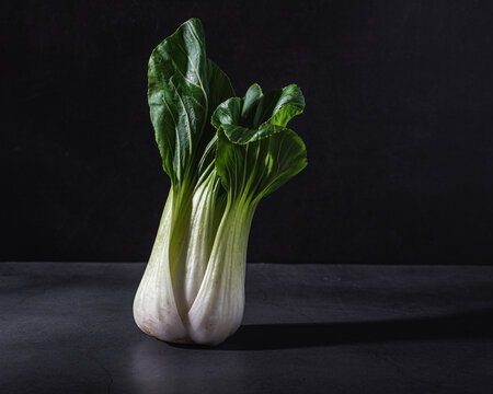Chinese cabbage on black table in studio