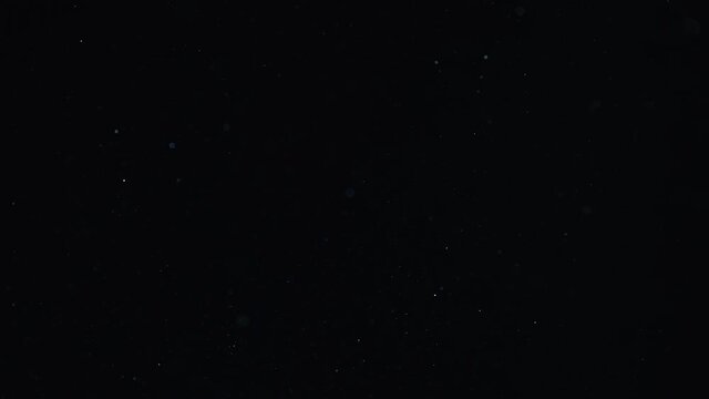 Natural Dust Organic Floating particles in stage light ray (spot) on black background. Dust in air atmosphere for your projects! Just drop it over your footage and use blending (screen) mode.