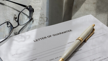 A letter of guarantee on the desk.