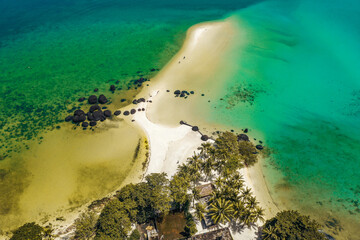 Beautiful tropical island koh Kham, white sand beach with volcanic rocks, near koh Mak, Trat, Thailand