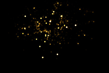 Golden blurred bokeh lights on black background. Glitter sparkle stars for celebrate. Overlay for...