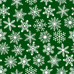 Seamless pattern snowflakes on green background vector illustration	