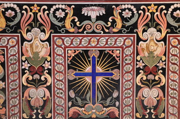 Colorful Inlaid Marble Altar Detail with Blue Cross at the Santa Maria della Vittoria Church in Rome, Italy