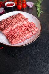 raw minced meat pork, beef or veal, lamb meal snack on the table copy space food background rustic. top view keto or paleo diet