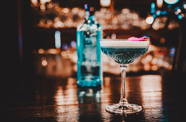 cocktail with gin, lime juice and soda on bar counter