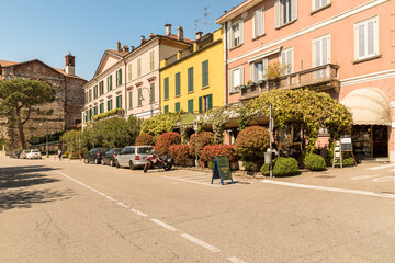 Naklejka premium Lakeside street of Angera on the shore of Lake Maggiore, province of Varese, Lombardy, Italy
