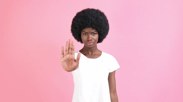 Angry protester lady show stop gesture crossed hands body language concept