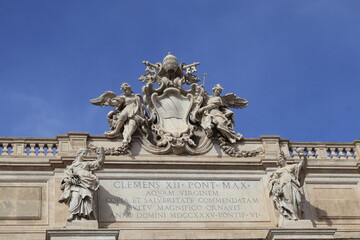 Trevi Fountain Facade Detail Against a Bright Blue Sky in Rome, Italy