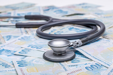 Turkish Currency and Stethoscope. Turkish Lira TL. Turkish banknotes. 100 Turkish Lira. Devaluation...