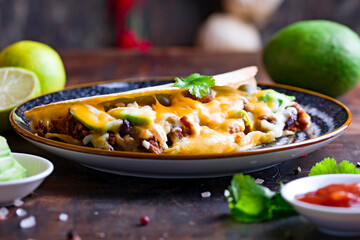 Homemade quesadilla with meat, avocado, jalapeno, and cheese